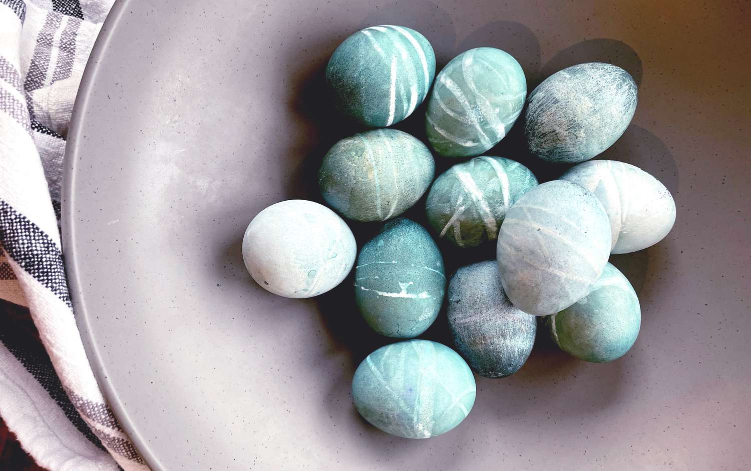 Shibori blue eggs in a bowl with a linen