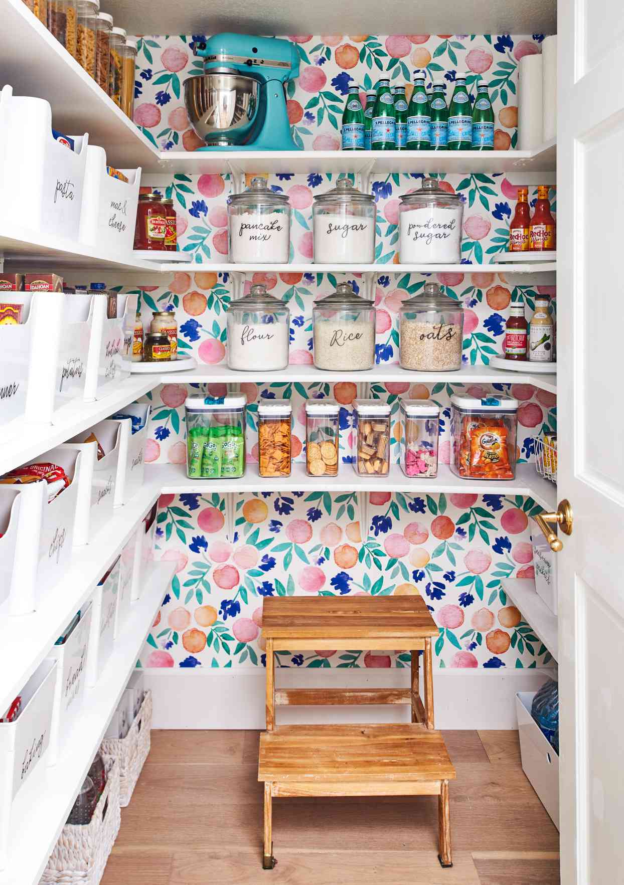 organized pantry with colorful wallpaper