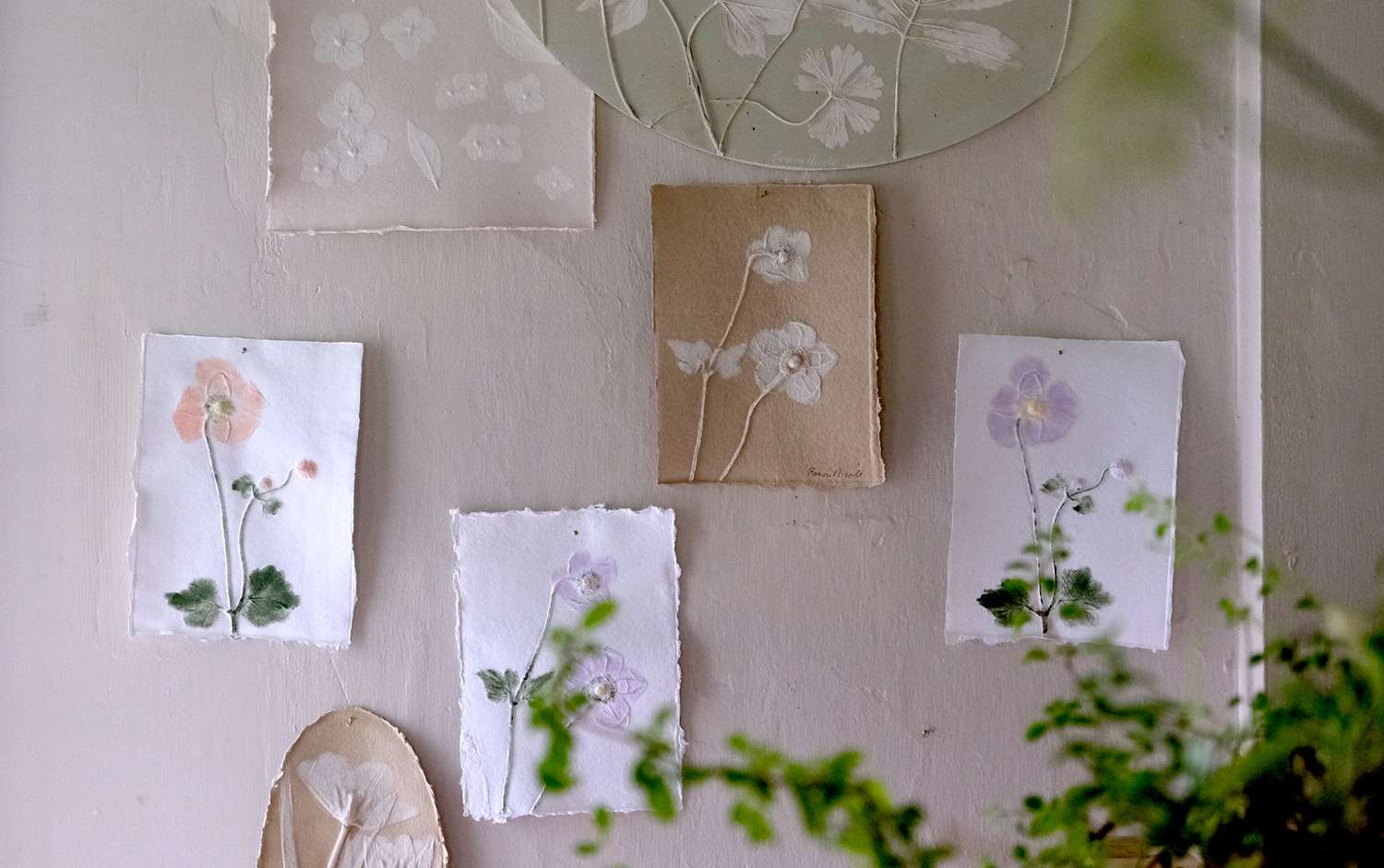 Floral paper artwork hung on the wall
