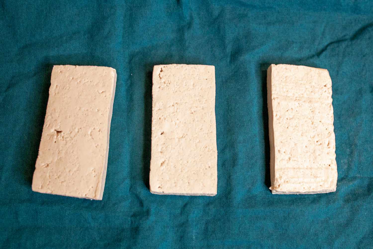 slices of tofu on teal tea towel