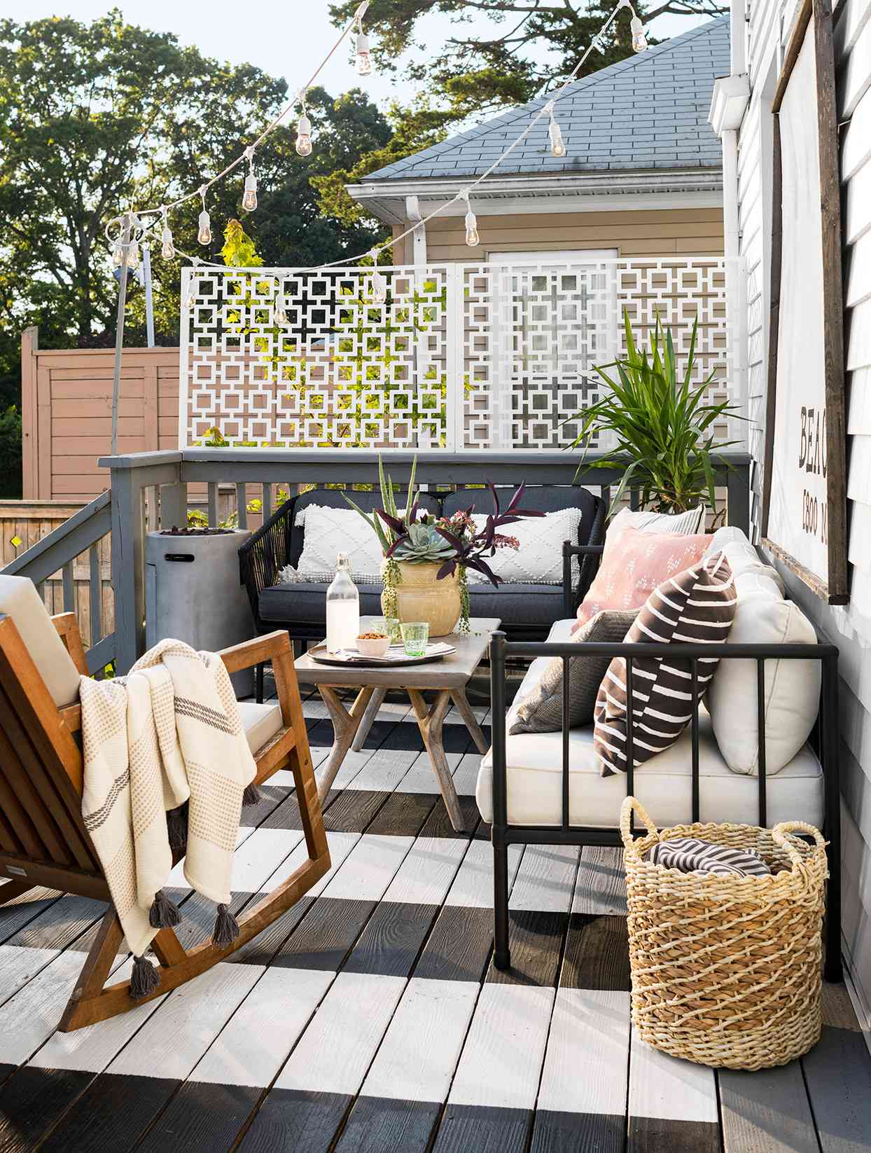 outdoor seating painted striped deck privacy screen basket lights