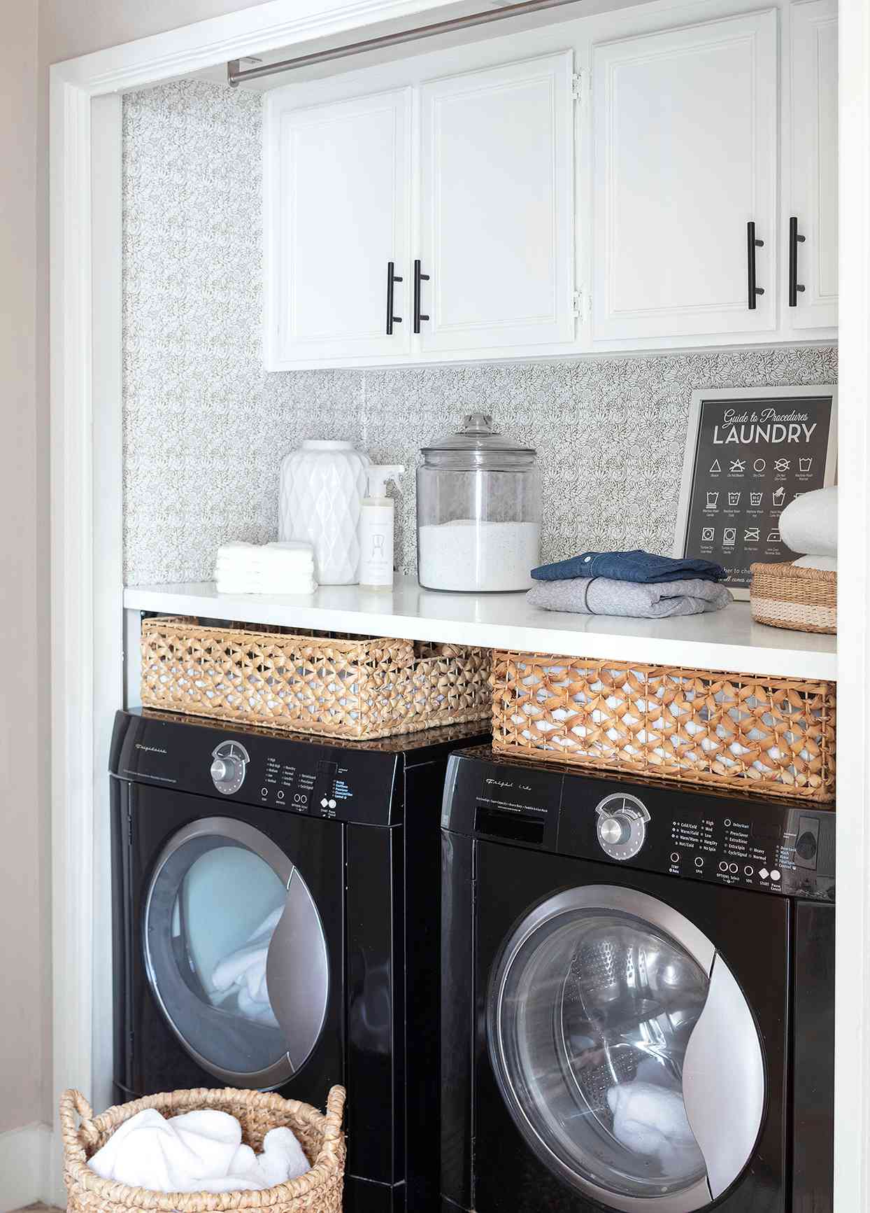 black front-load washer dryer laundry nook baskets wallpaper