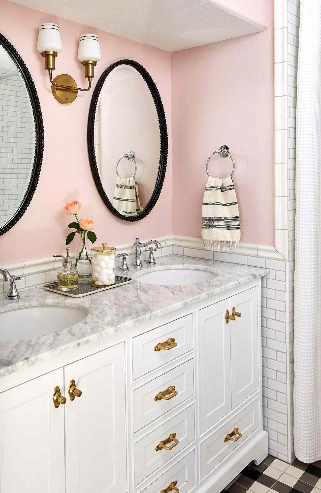 pink bathroom walls double white vanity gold pulls oval black mirrors