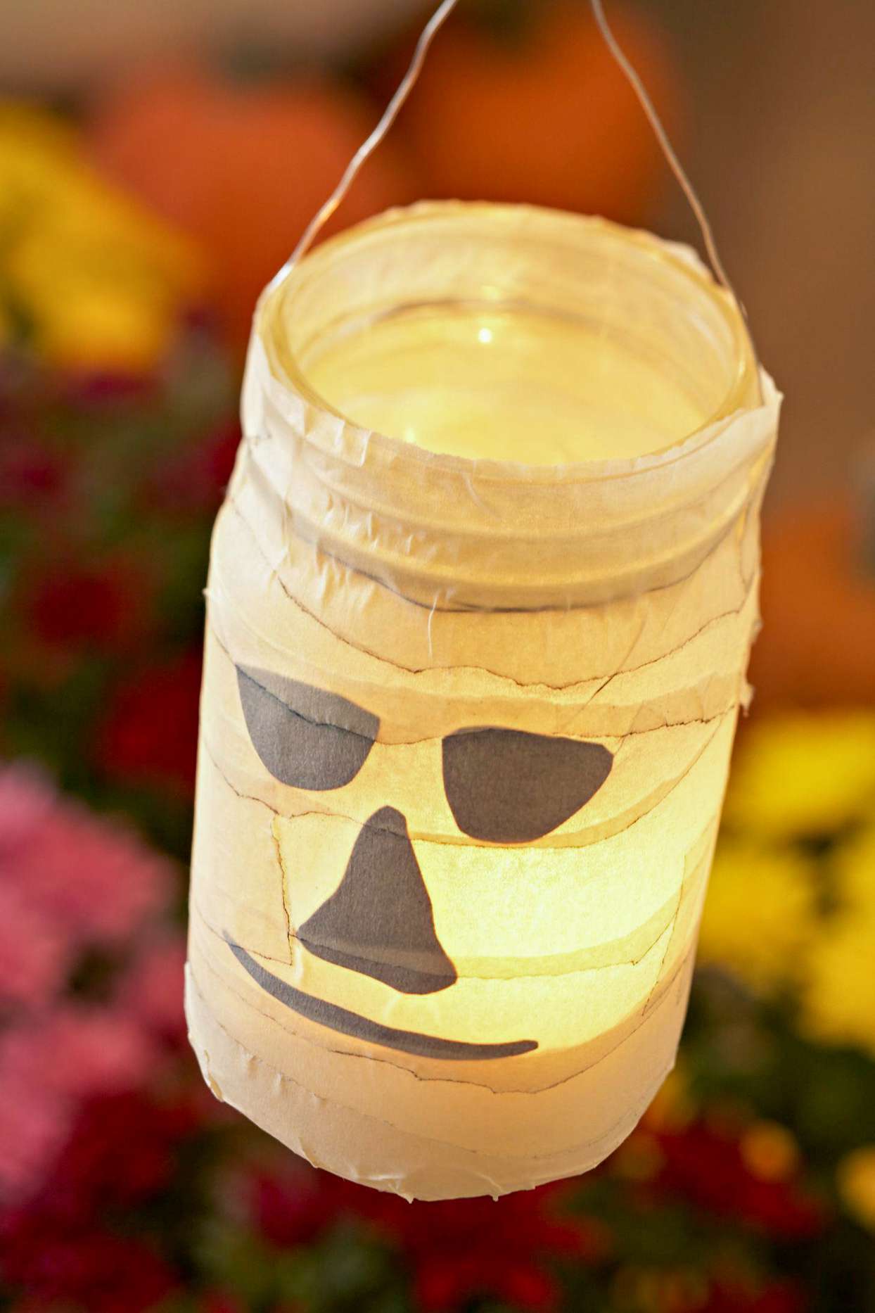ghost wrapped mason jar lantern