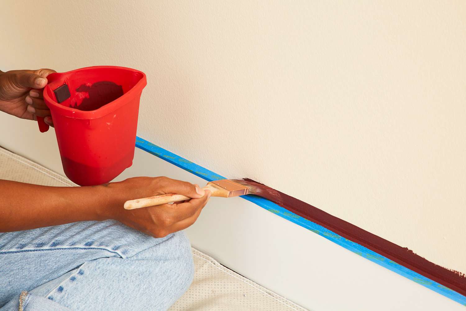 painting wall with brown paint