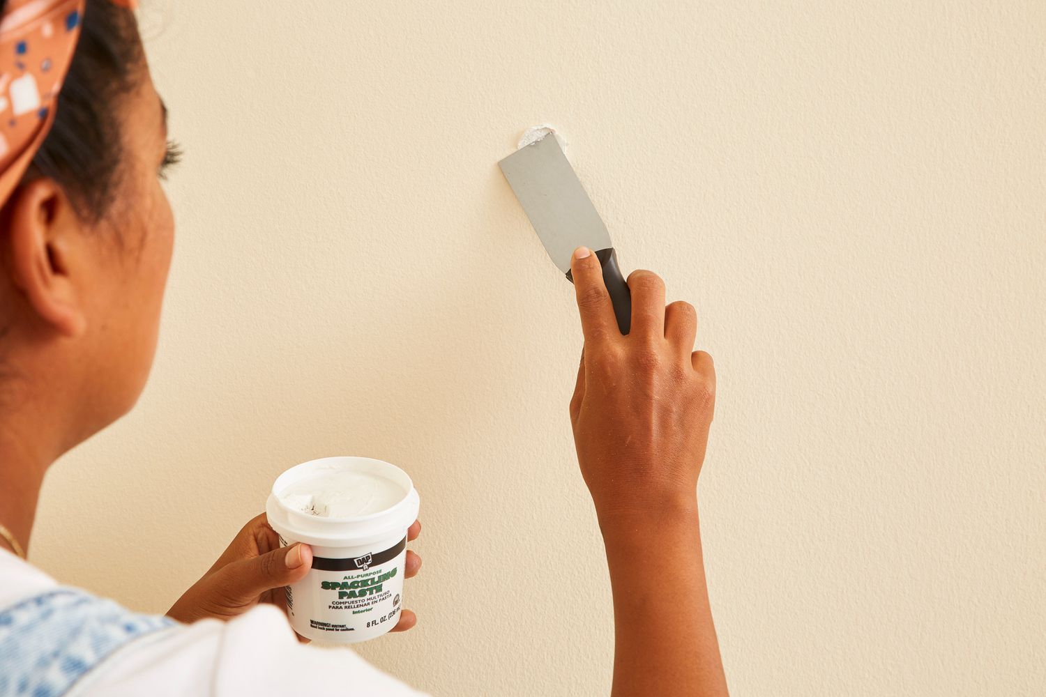 placing putty on wall