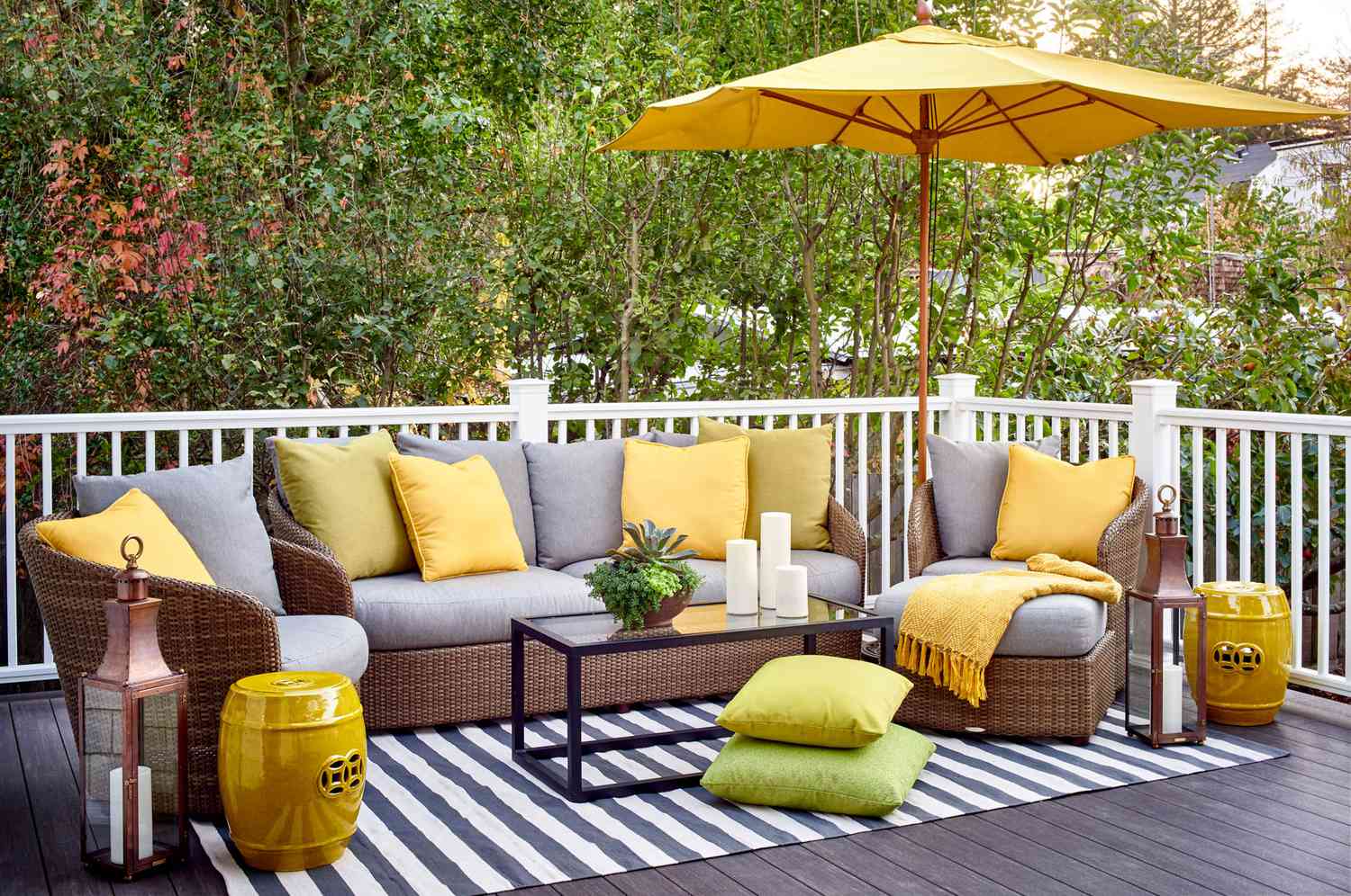 gray patio furniture yellow accents umbrella
