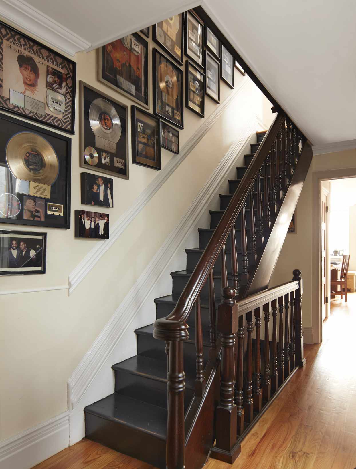 entryway with gold records and stairs