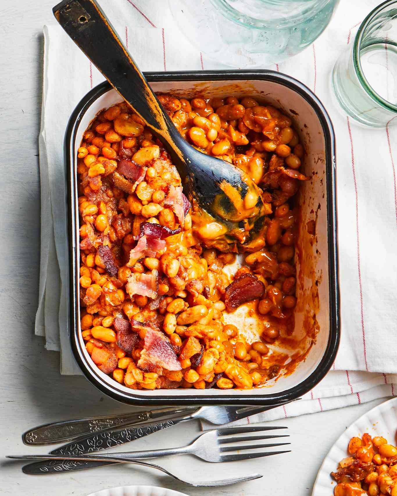 Apricot-Sweetened Bacon Baked Beans in casserole dish