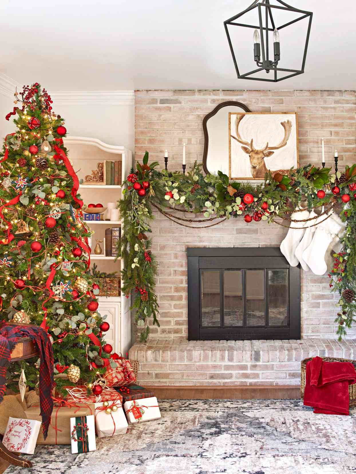 living room with fireplace and red decorated christmas tree