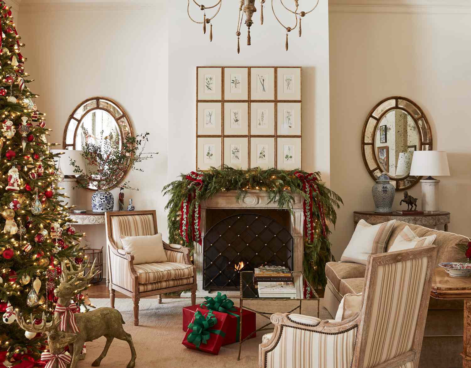 living room with christmas tree and garland on fireplace