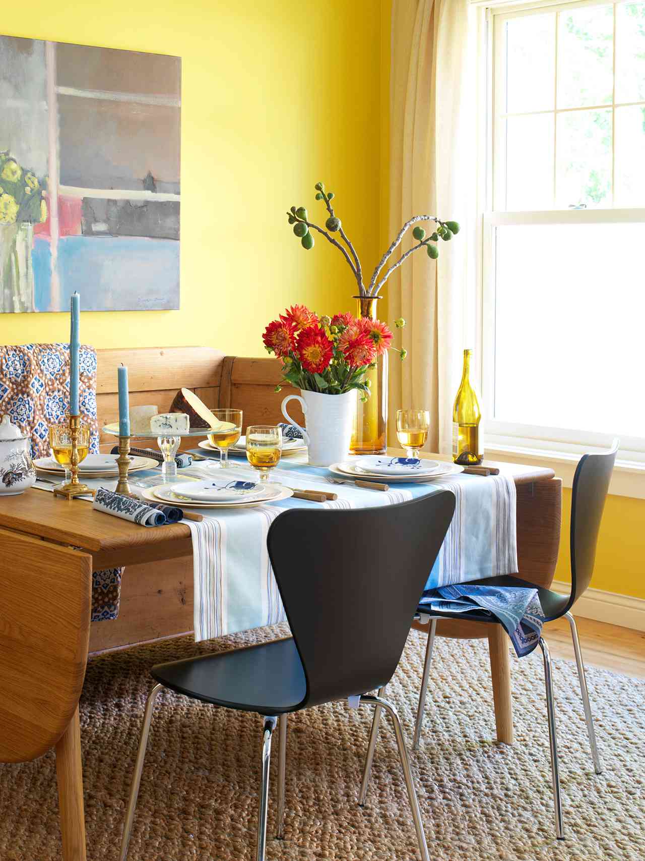 yellow-walled dining room modern chairs