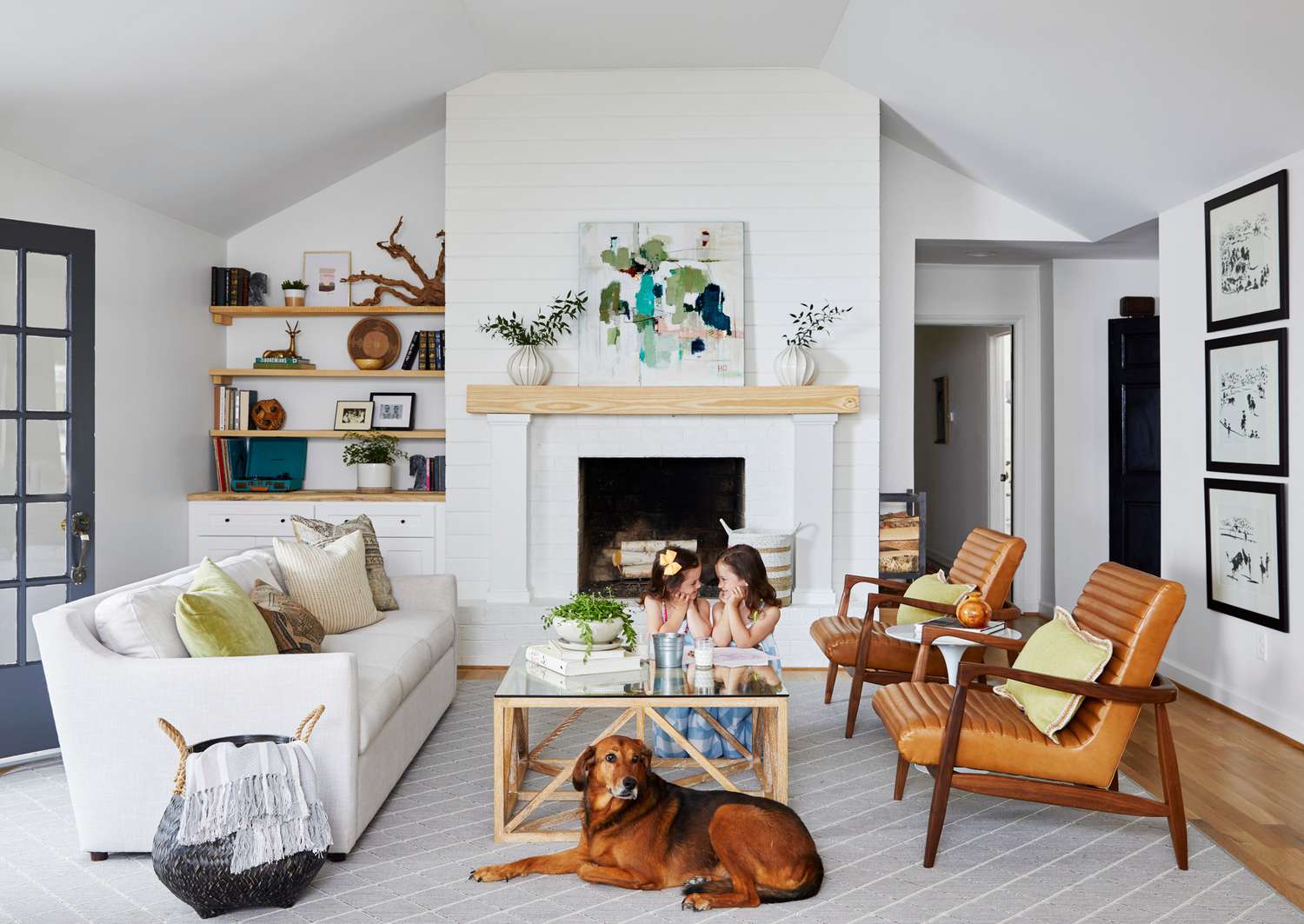 a-frame ceiling living room with dog and daughters