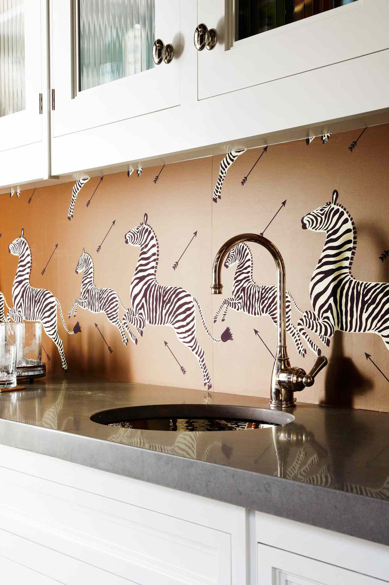 kitchen sink with zebra wallpaper