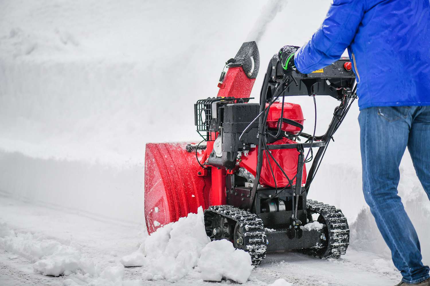 person using snowblower to remove snow from prooerty