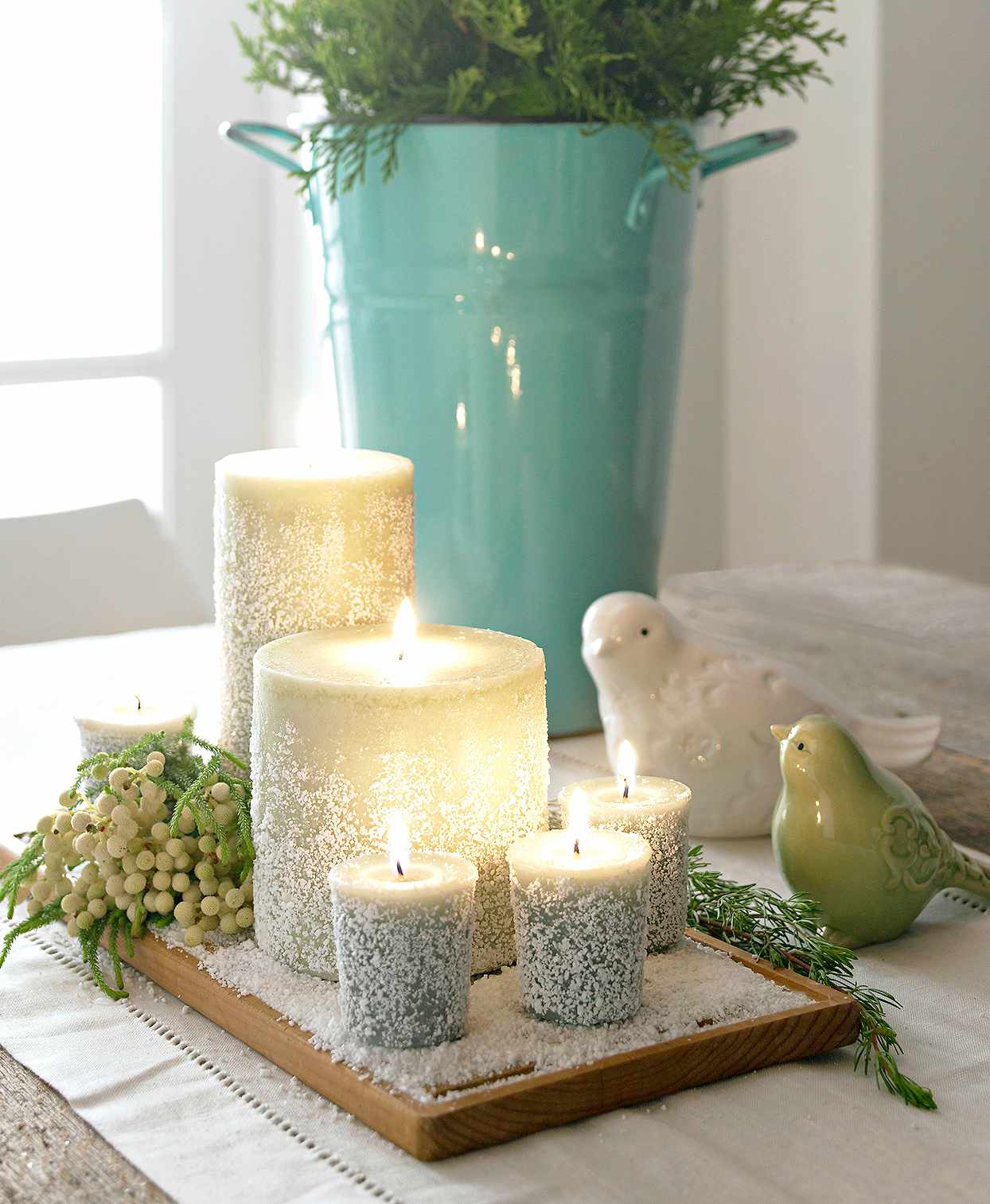 snow-flecked frosted candles berries fake snow birds winter scene table centerpiece
