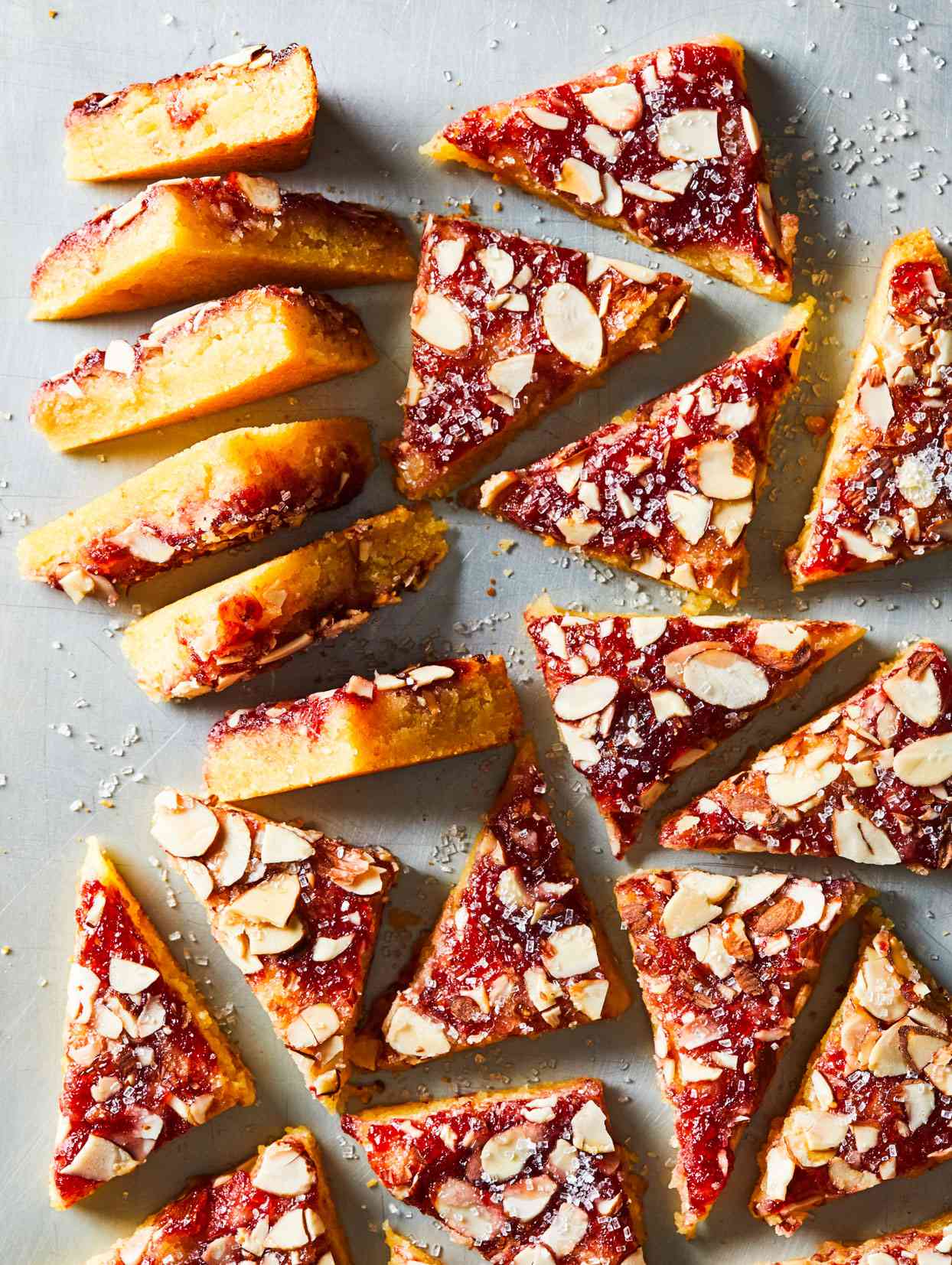 triangles of Dutch Letter Bars topped with jam and sliced almonds