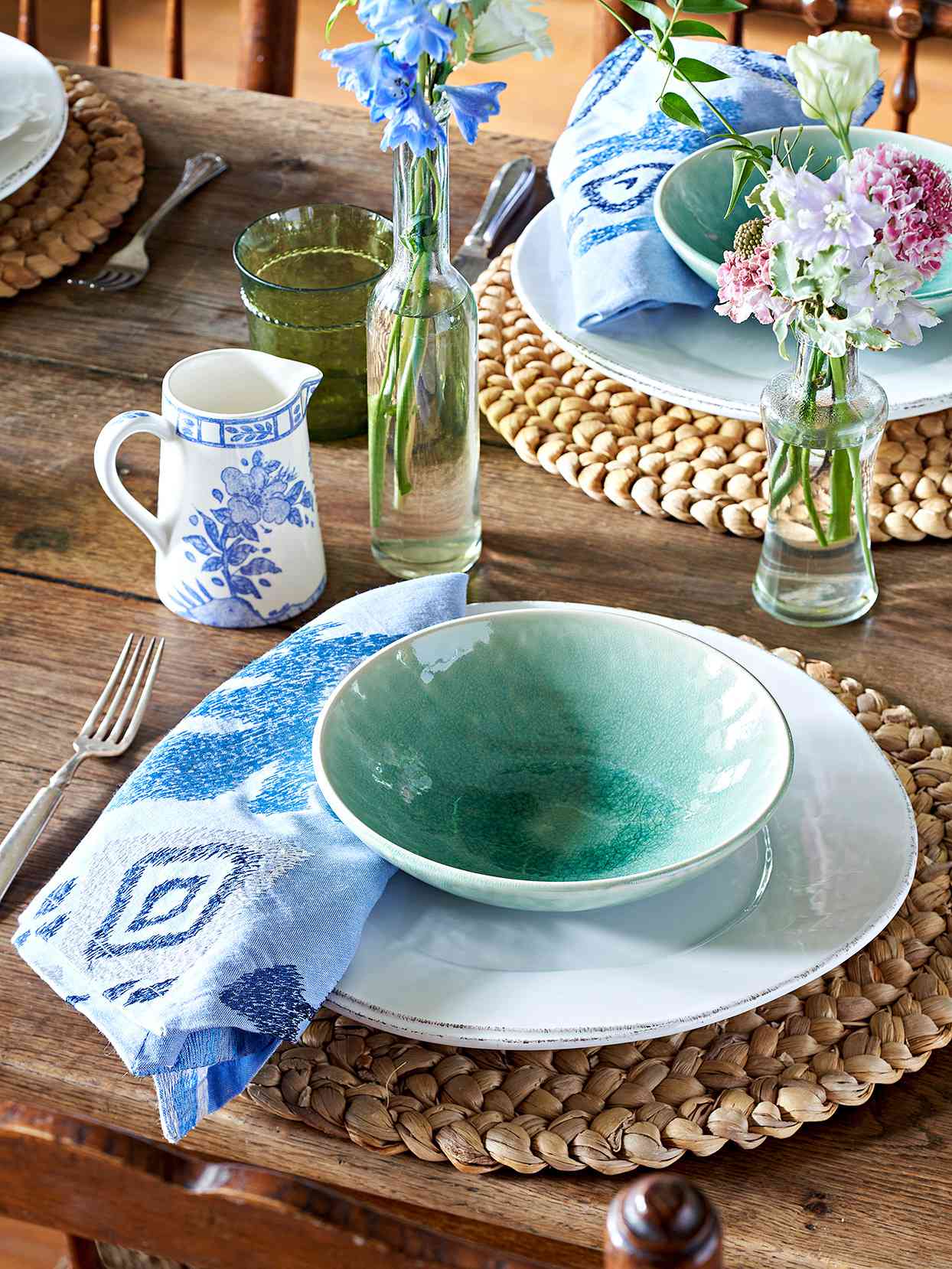 wood table setting green blue dishes china napkin charger bud vases place setting