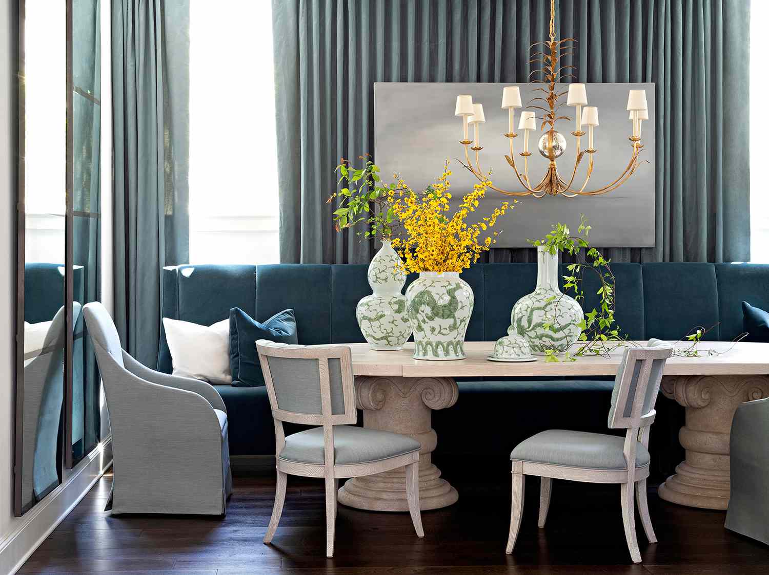 blue teal dining area large table green vases gold chandelier chairs