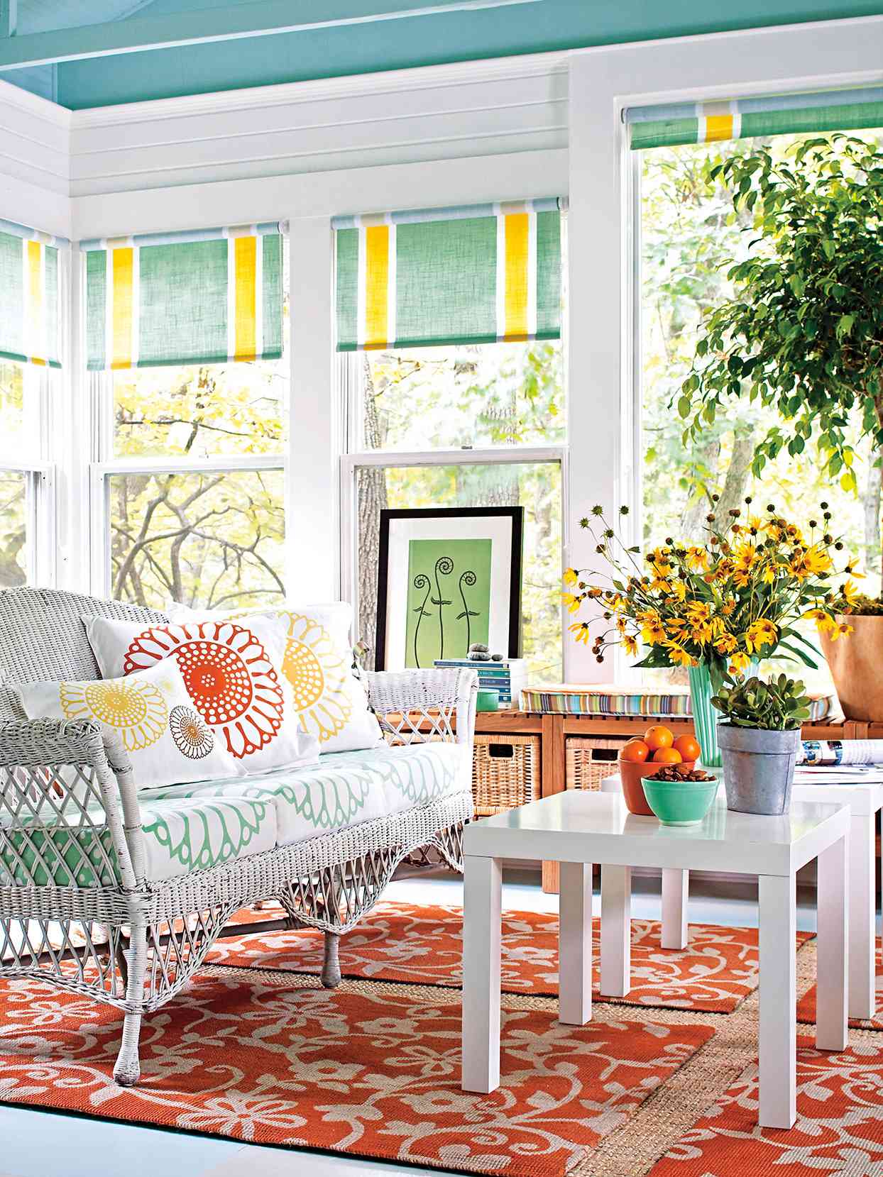 green yellow roller shades white rattan loveseat orange rugs tables enclosed porch