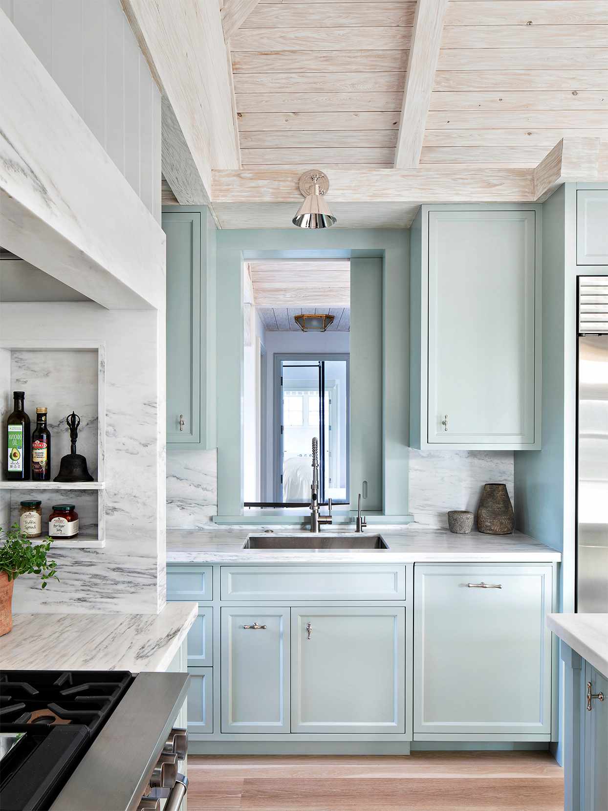 sea glass-green blue kitchen cooking area peek-through window sliding door