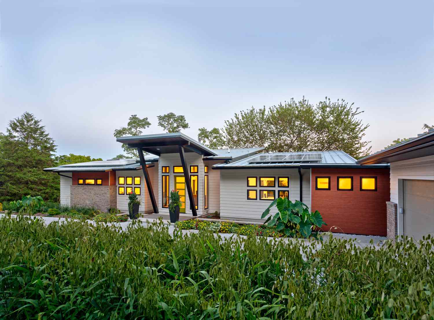 exterior view of sustainable home with solar panels on roof