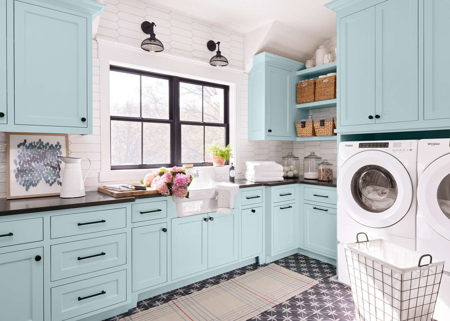 laundry room with blue cabinetry