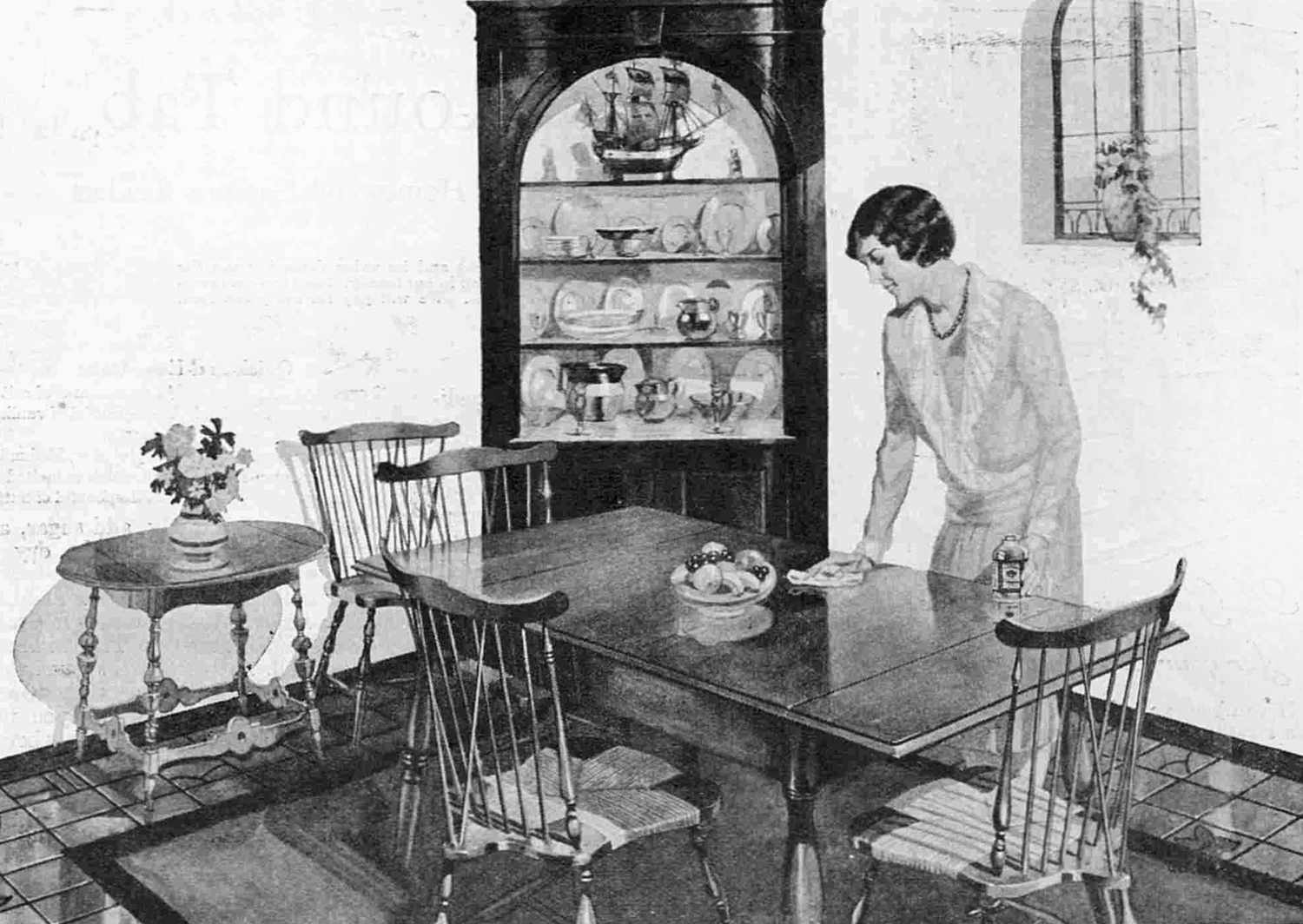 woman in 1920s dining room with wooden table and cabinet with dishes on display