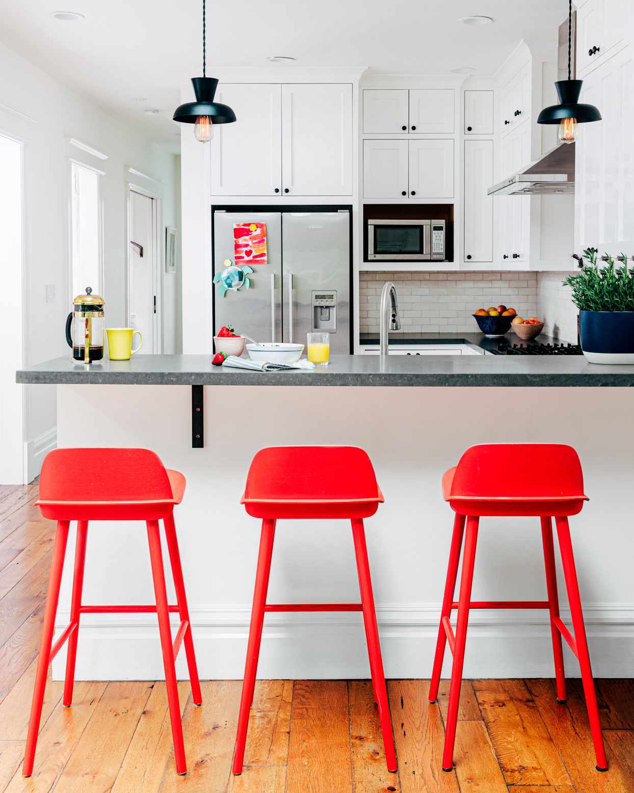 red bar stools at kitchen counter