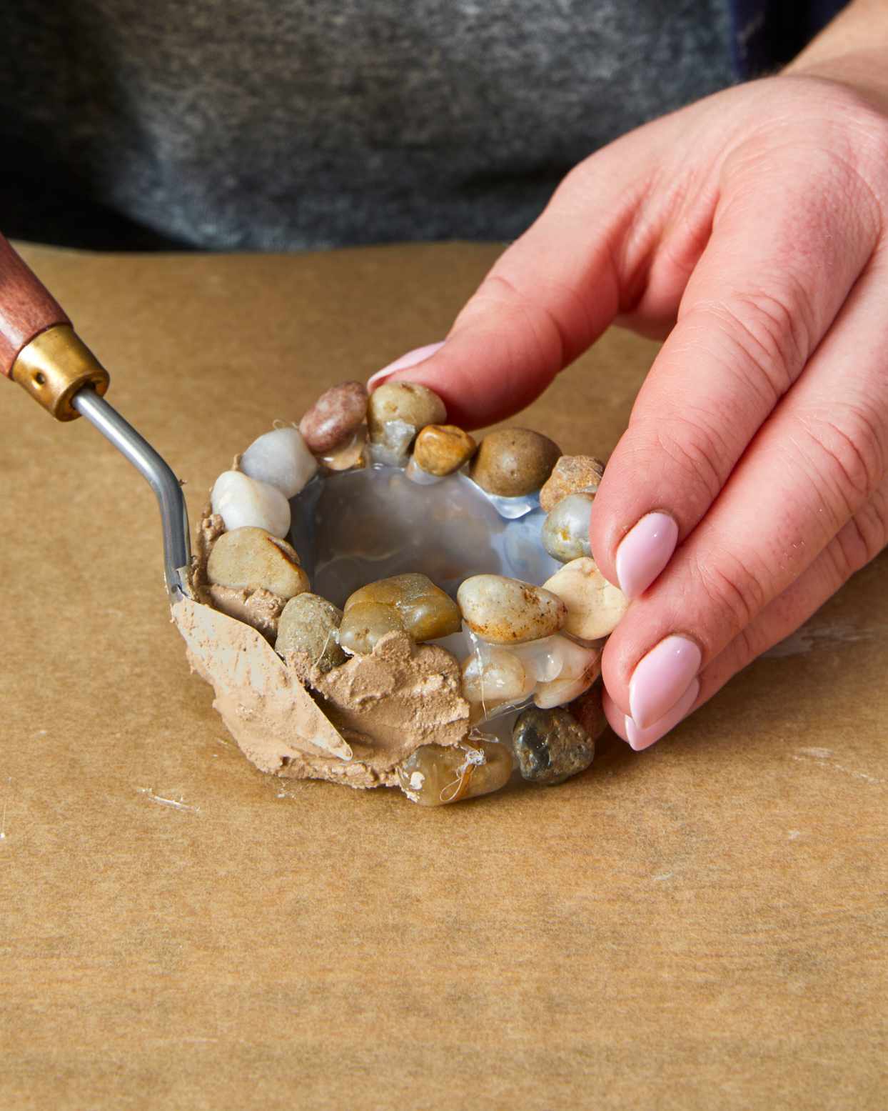 adding clay to miniature well