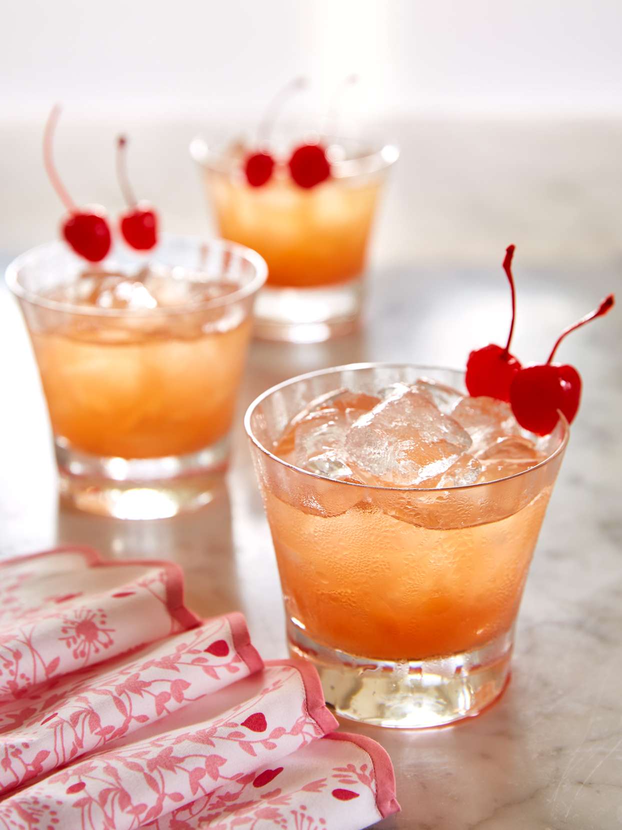 apricot champagne punch garnished with cherries