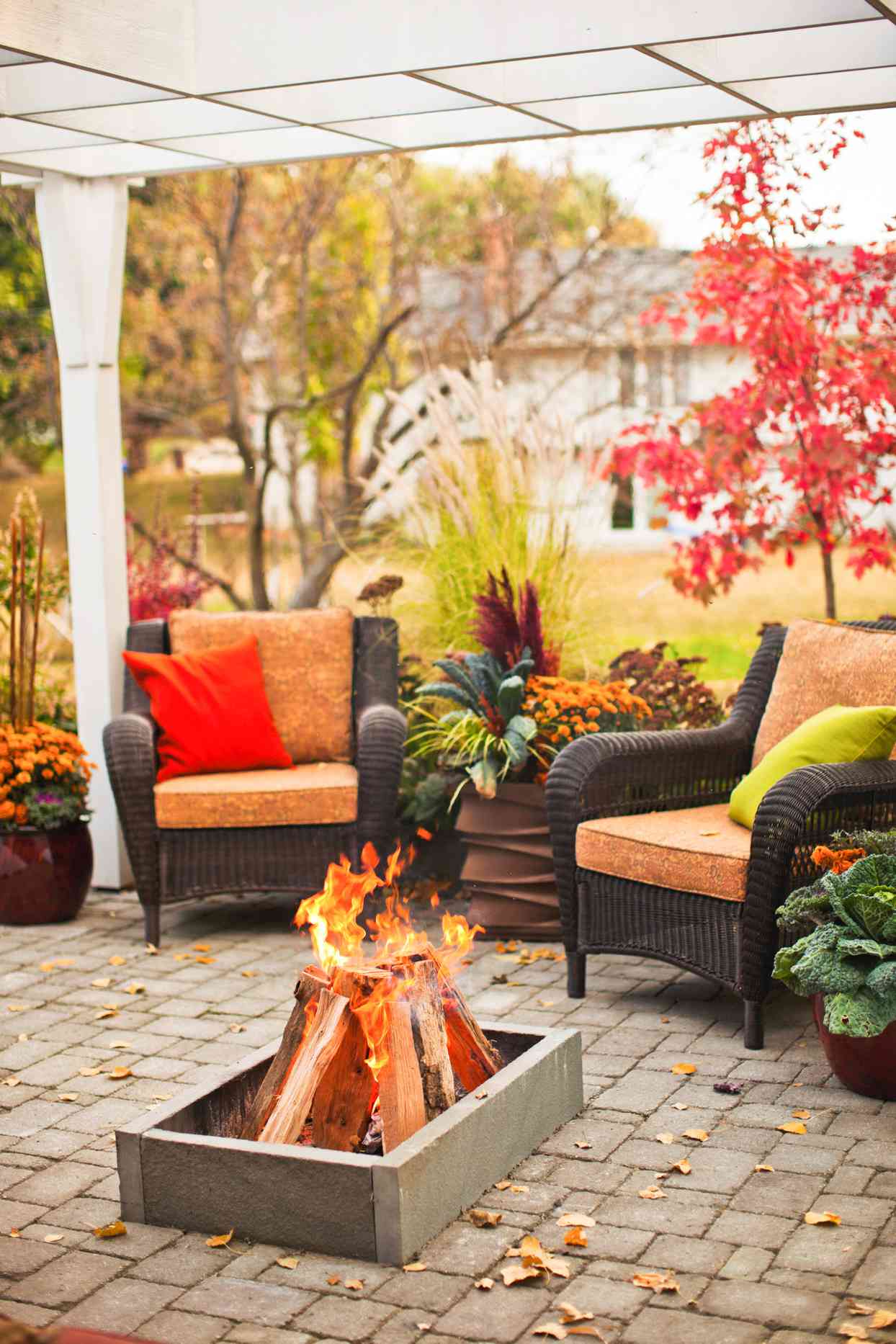 outdoor covered area with chairs and fire pit