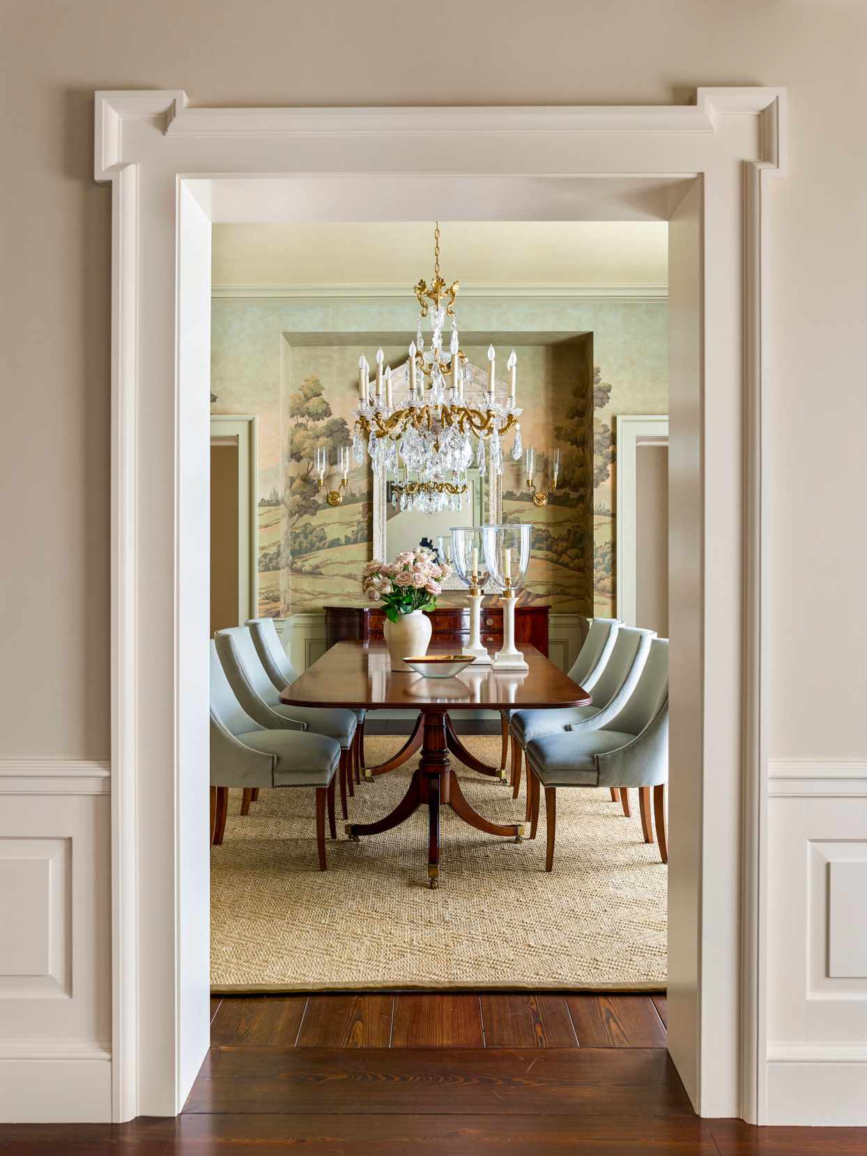 elegant entryway into dining room with chandelier