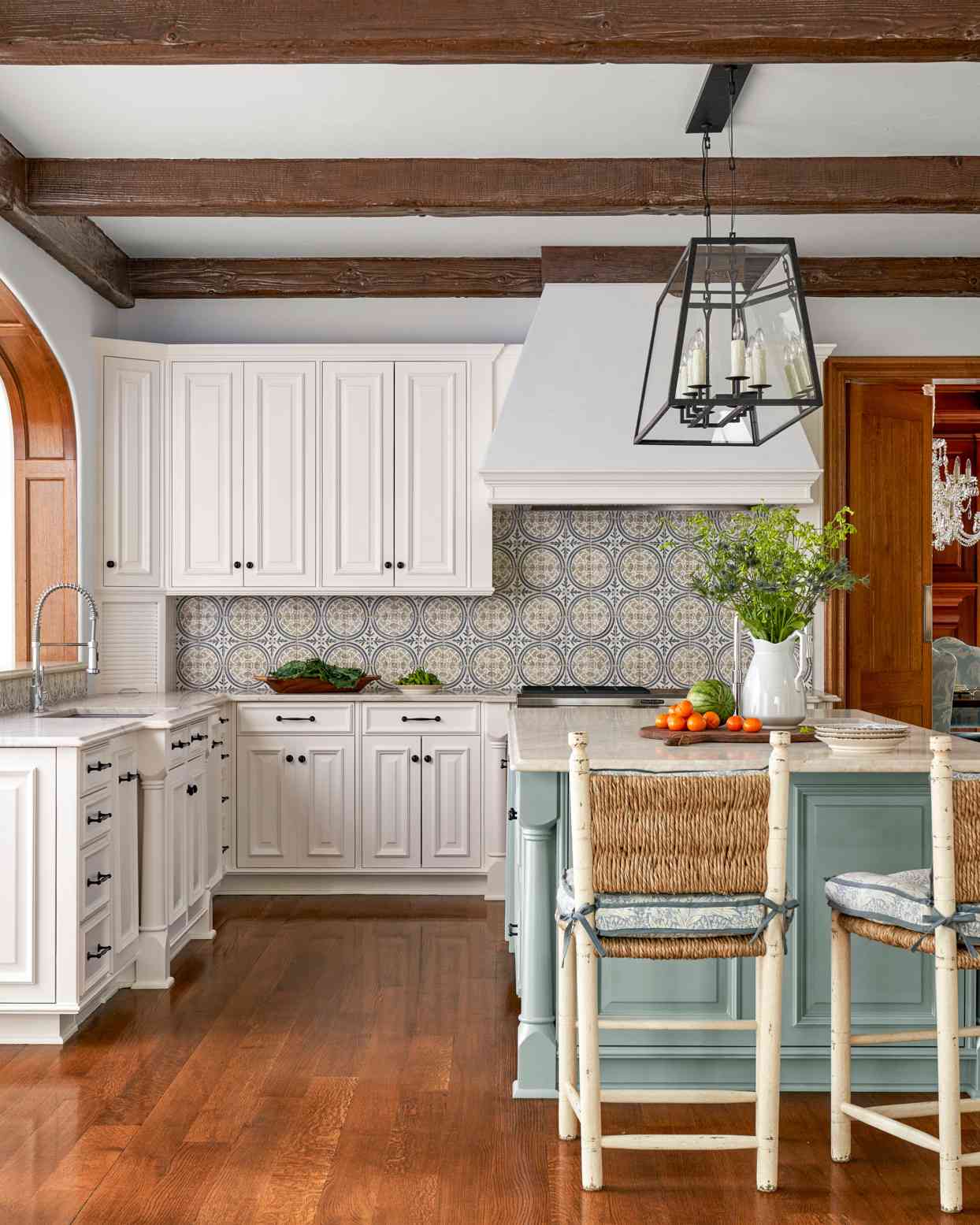 hand-painted backsplash tiles in white and blue kitchen