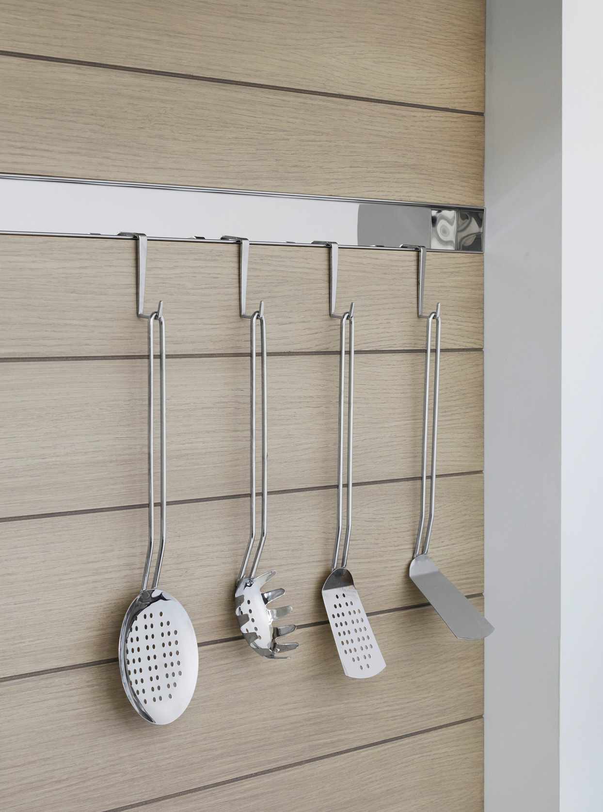 hanging metal utensils in kitchen