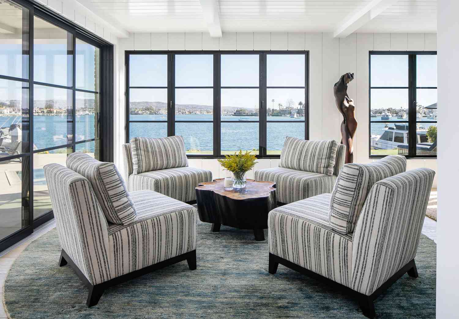 striped chairs in bay view sitting room