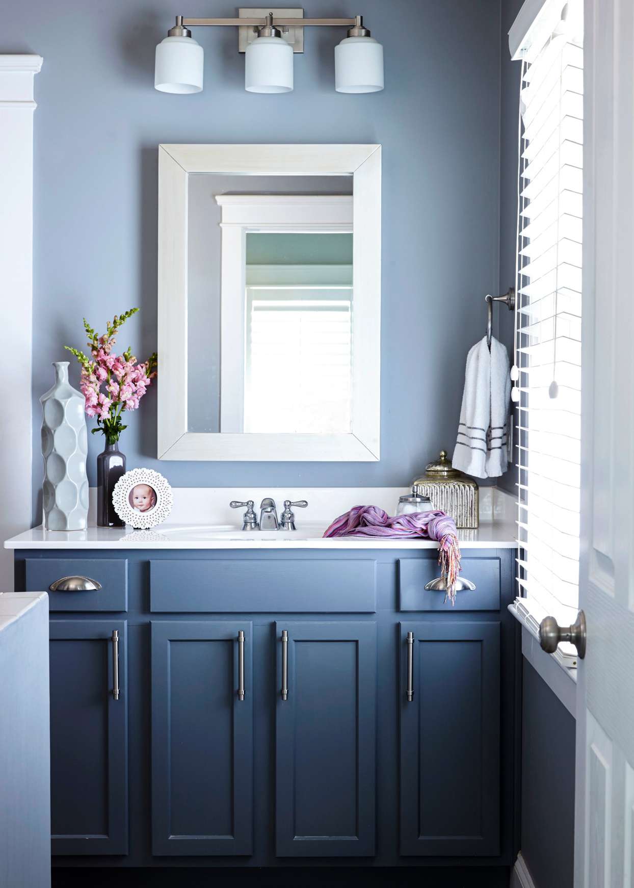 blue bathroom with dark blue vanity