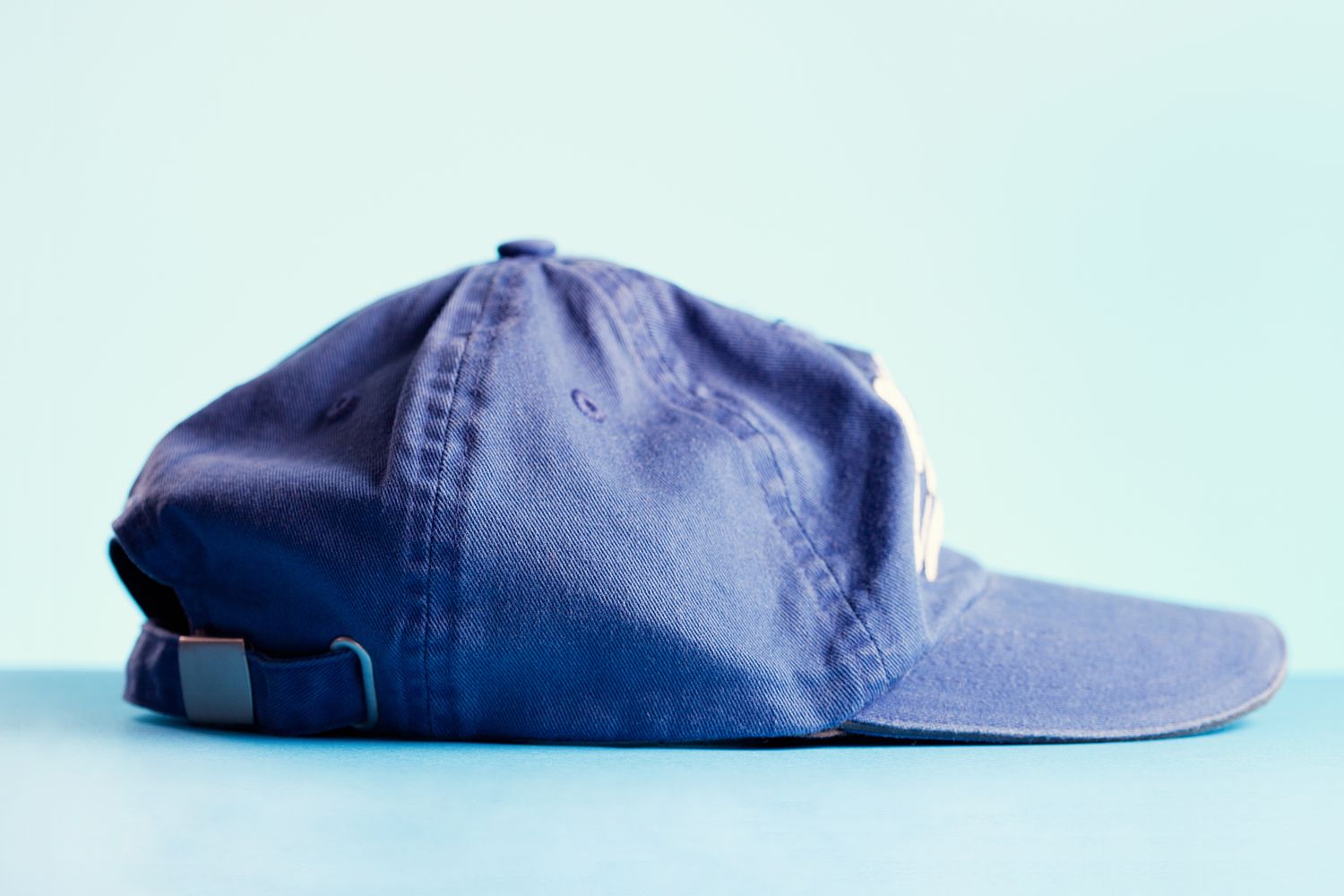 blue baseball cap on blue background
