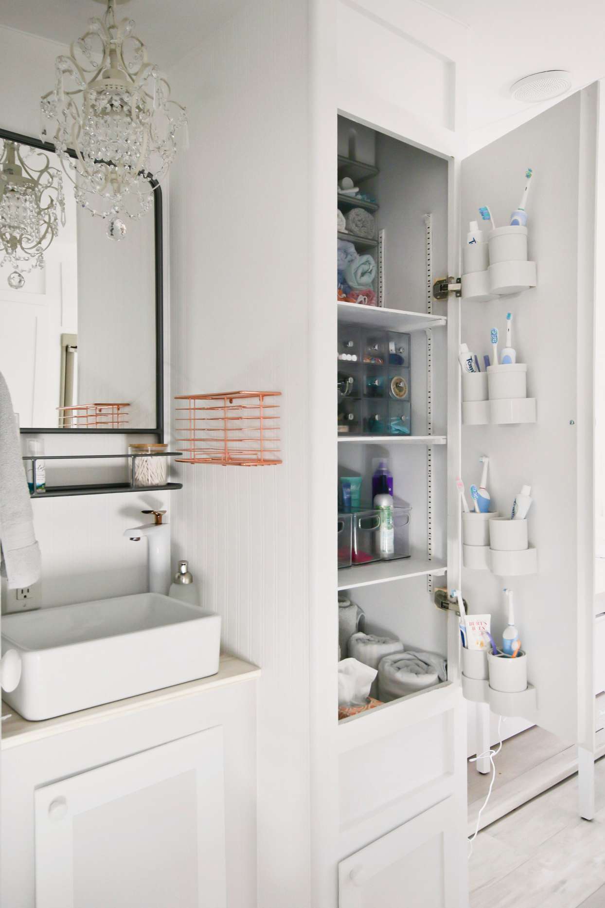 white bathroom with storage cabinets