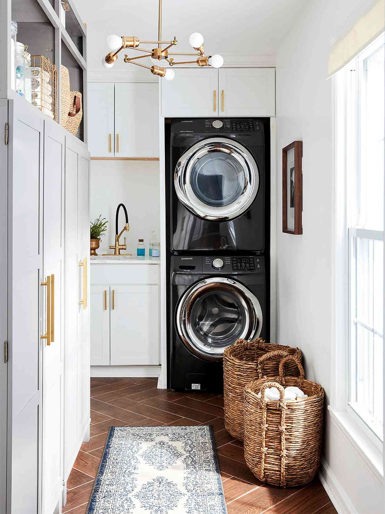 mudroom black appliances gold accents light gray cabinets