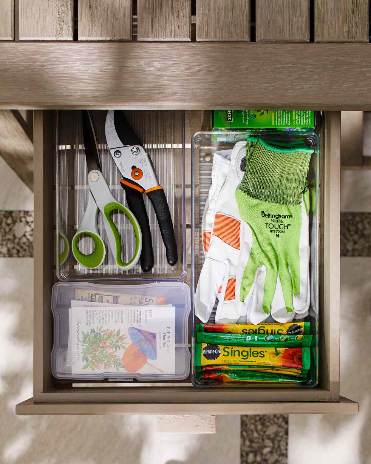 gardening supply drawer with gloves and shears