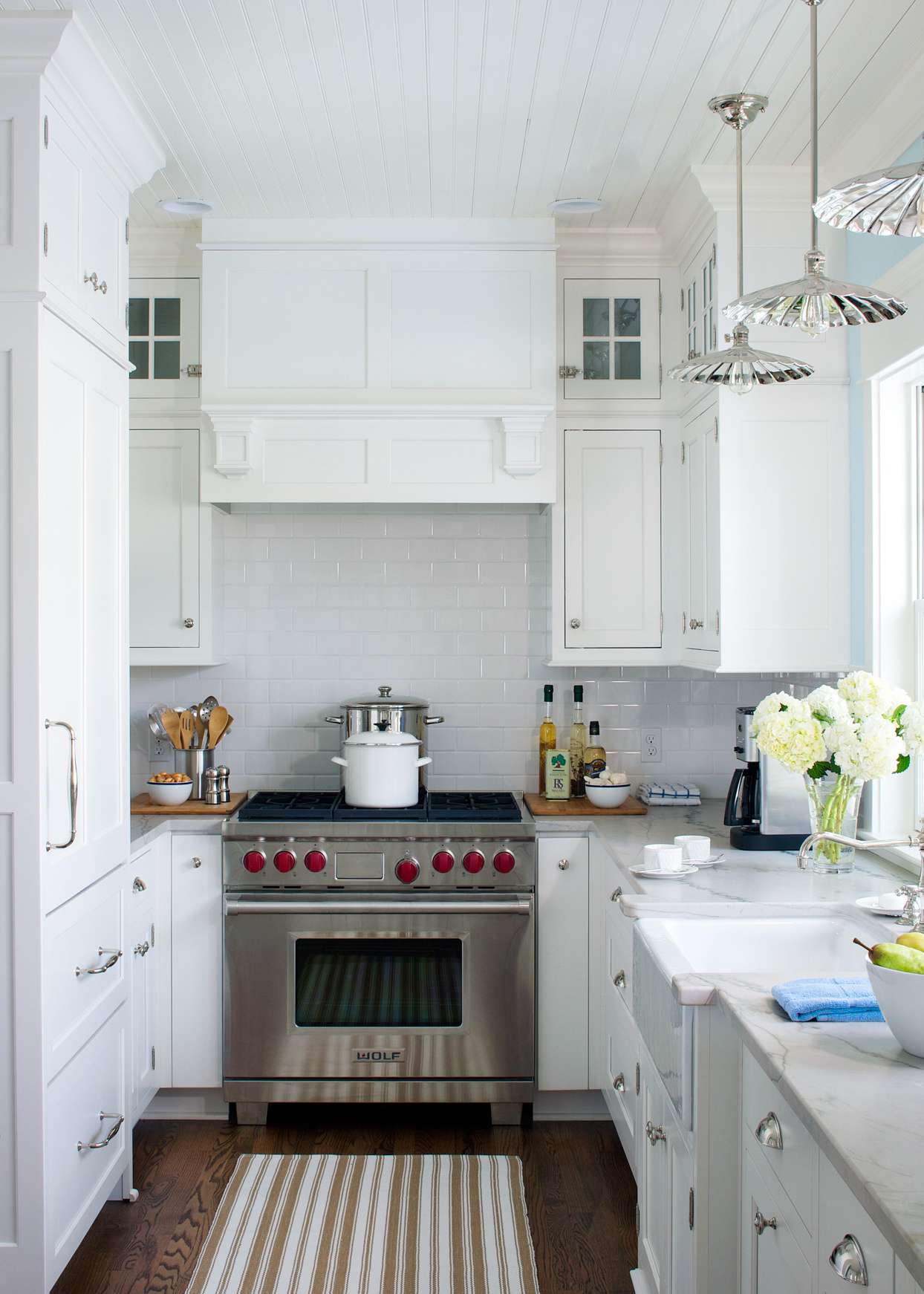 white kitchen cabinets with white subway tile backsplash