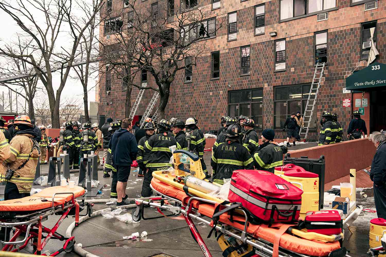 Emergency first responders remain at the scene of an intense fire at a 19-story residential building that erupted in the morning on January 9, 2022 in the Bronx borough of New York City. Reports indicate over 50 people were injured.