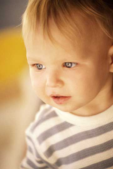 Closeup of Toddler in Striped Shirt Looking Away
