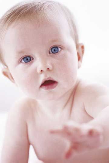 Baby Boy with Blue Eyes Reaching for Camera