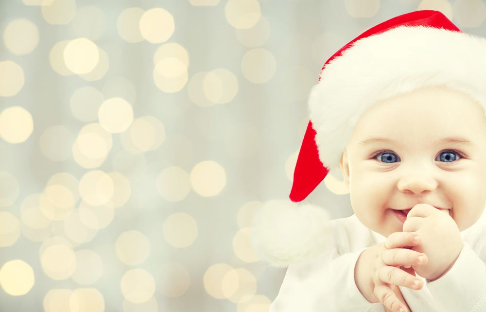 Happy Baby During Holidays Wearing Santa Hat