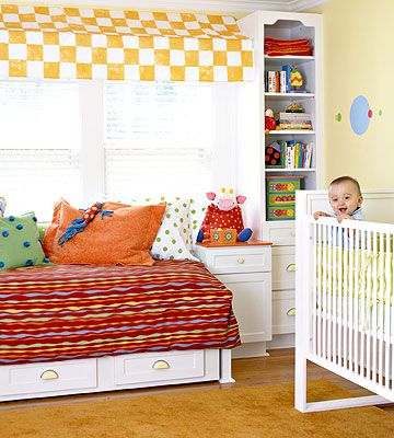 baby boy smiling in crib in Ultimate Nursery