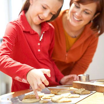 Mother and daughter baking cookies