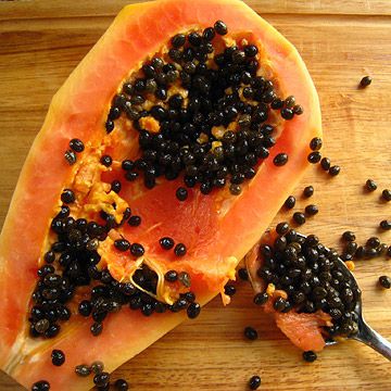 scoop out seeds of papaya