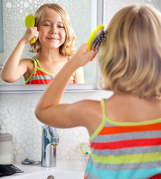 child brushing hair